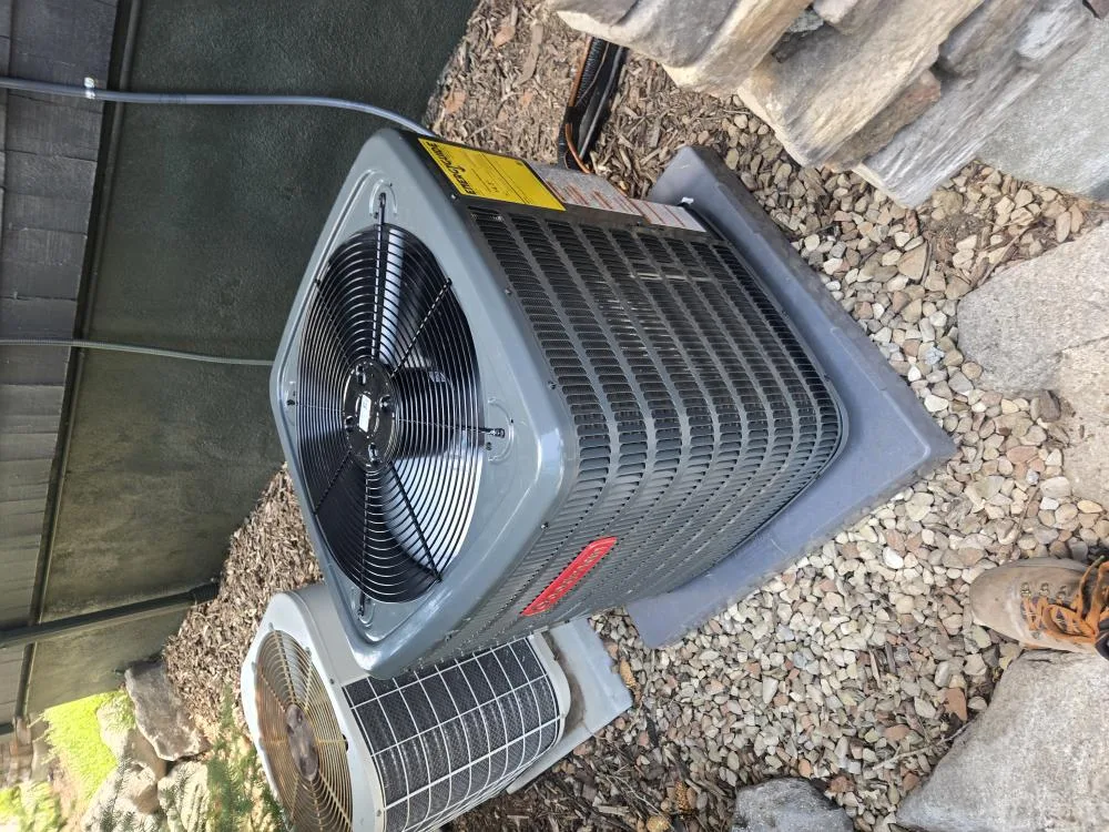 Sunny Home Services technician repairing an air conditioner along the Wasatch Front