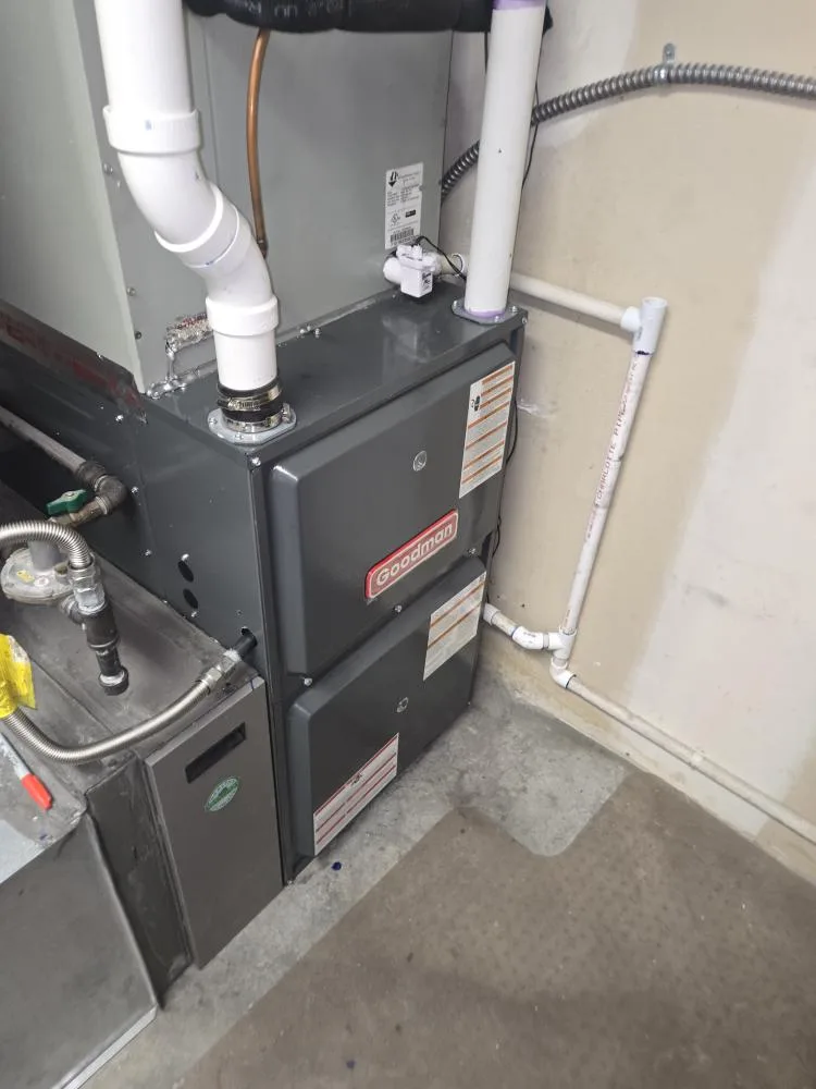 Sunny Home Services technician servicing a furnace along the Wasatch Front