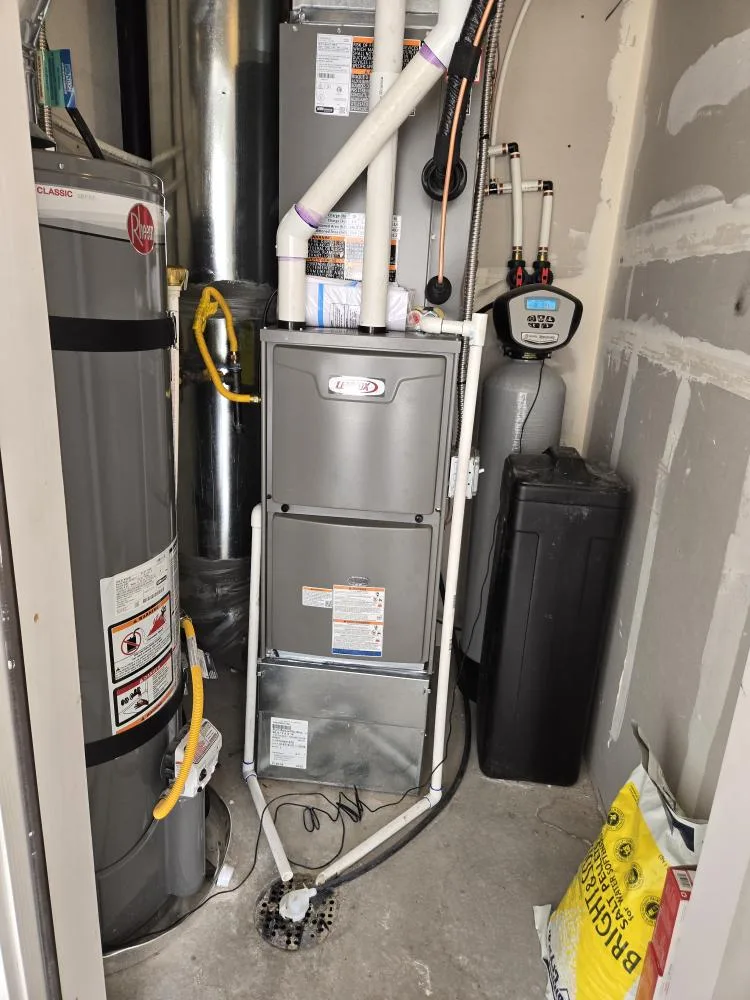 Sunny Home Services technician diagnosing a furnace