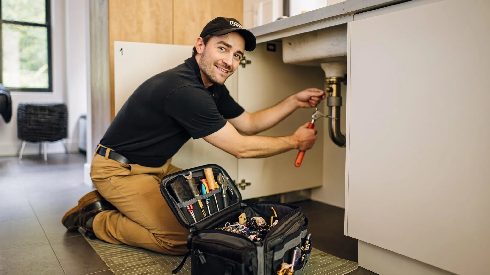 Sunny Home Services plumber arriving for an emergency call